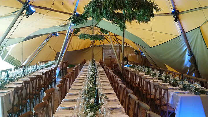 Eucalyptus garlands and foliage hoops at tipi wedding